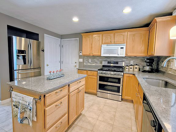 Kitchen. One door leads to the garage. The other door is the combined pantry / coat closet.