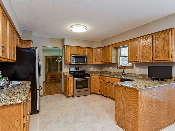 This updated kitchen boasts beautiful granite counter tops and stainless steel appliances.