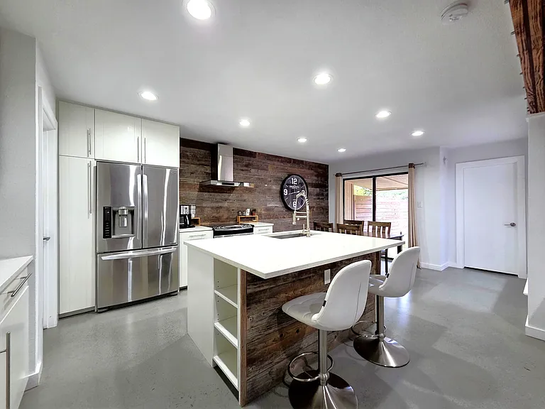 Modern Open Kitchen with high end steel appliances