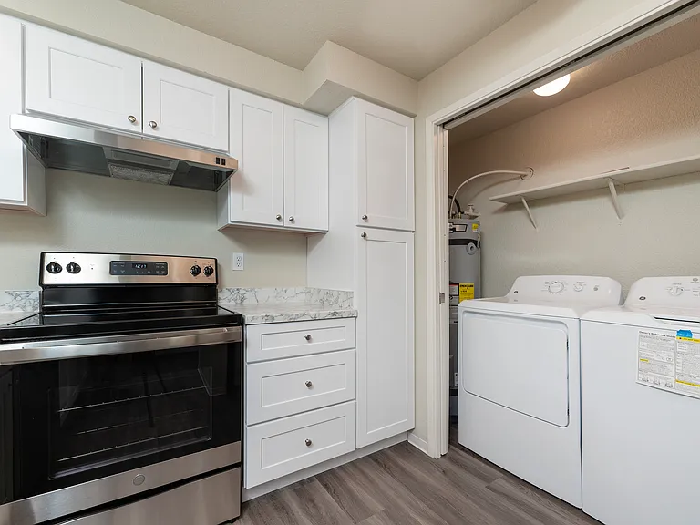 Experience convenience with a sleek kitchen and in-unit laundry. Experience convenience with a sleek kitchen and in-unit laundry.
