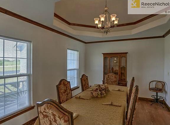 Formal dining room has a huge cathedral ceiling adding to the im