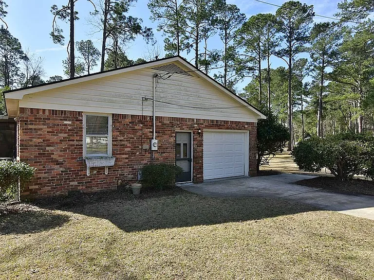 side entry with garage door view