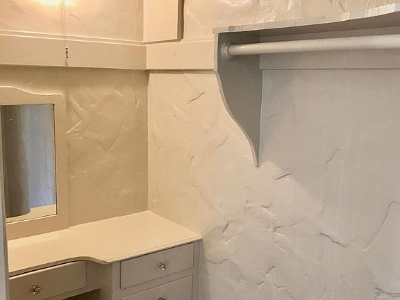 Huge extra living room closet with built-in vanity