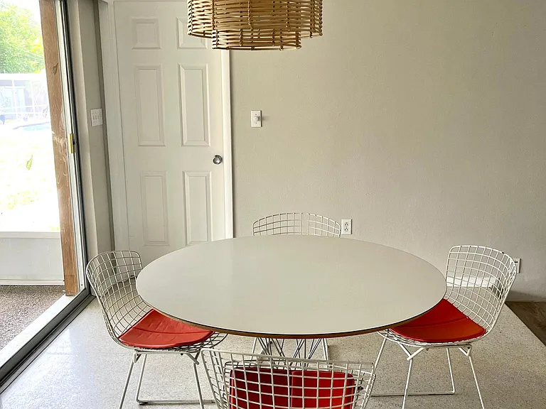 Dining room with door to primary bedroom
