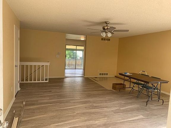 Large Living Room view from Front door - all new LVP floor, paint, light/fan, electrical, blinds.