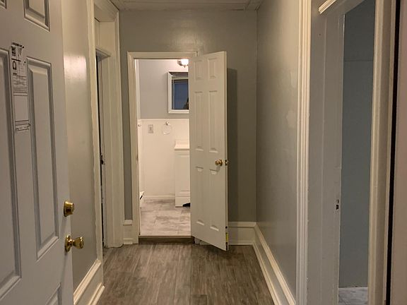 Hallway entrance. Bedroom 1 and 2 or Bedroom and Living room to the left. Kitchen to the right. Rear bedroom on the other side of the kitchen.