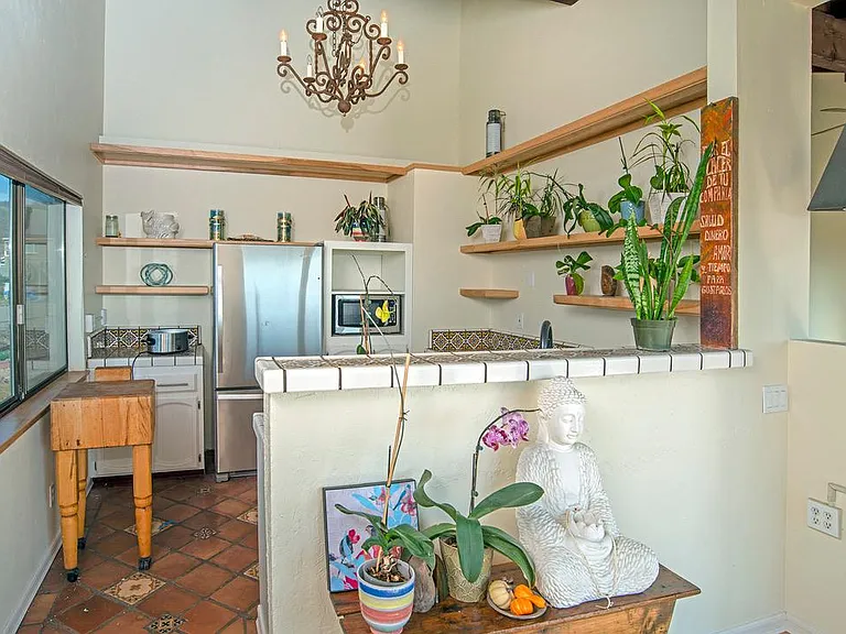 View of kitchen from dining room-stainless steel Whirlpool refrigerator & microwave/convection oven