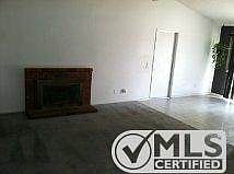 Dining room and living room with fireplace.