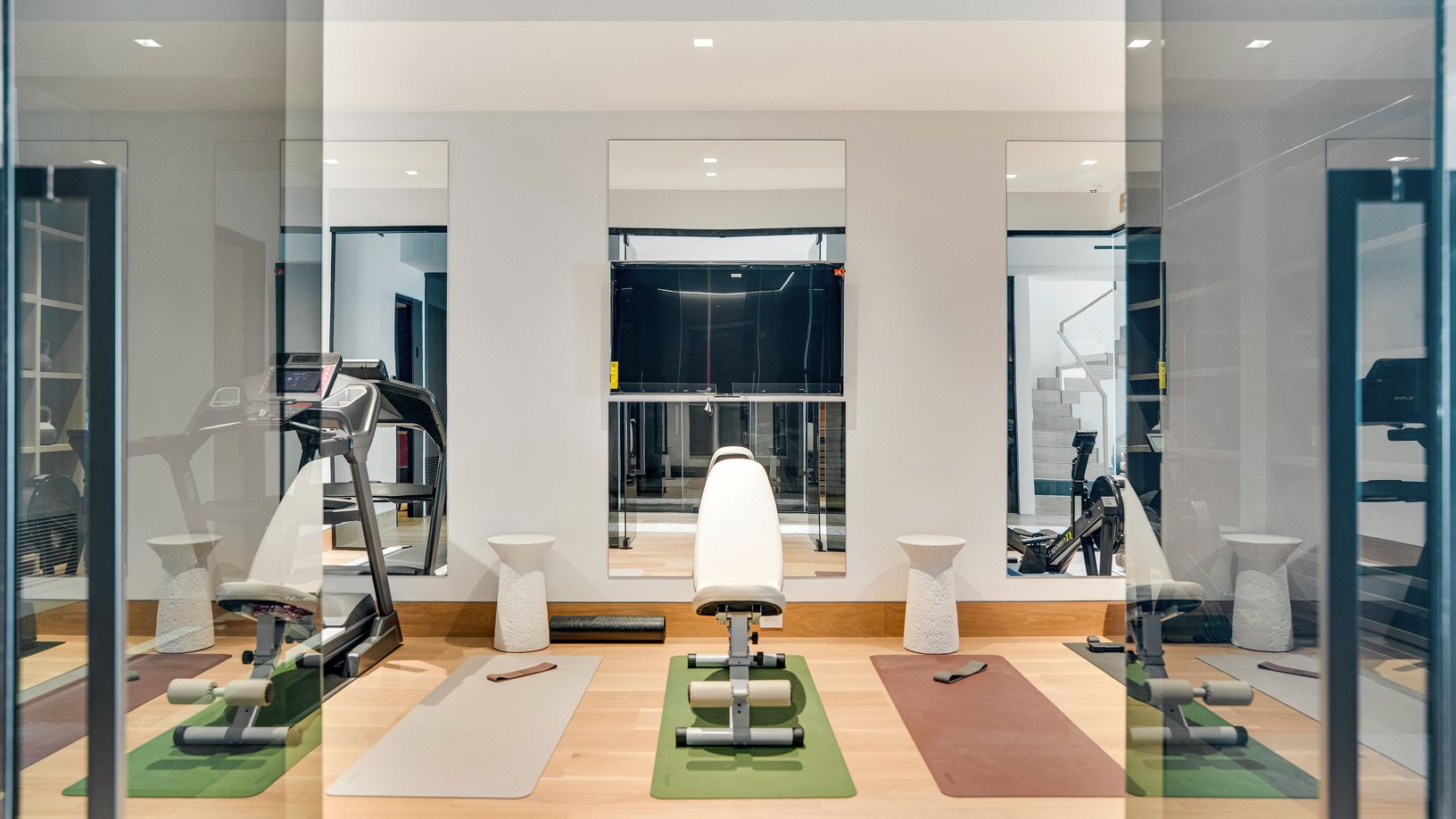  Gym Entry with smoked black glass to see out but still create some privacy from inside 