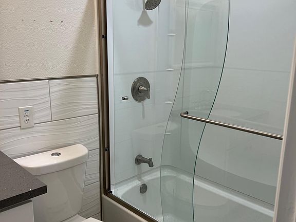 Bathroom with Glass Dors, custom tile quartz counter sink