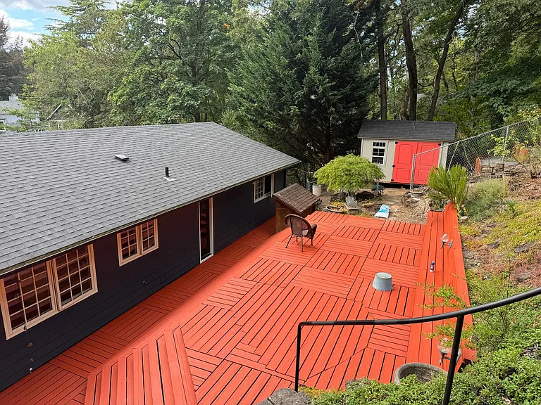 Multiple decks in the back yard, shed in the back