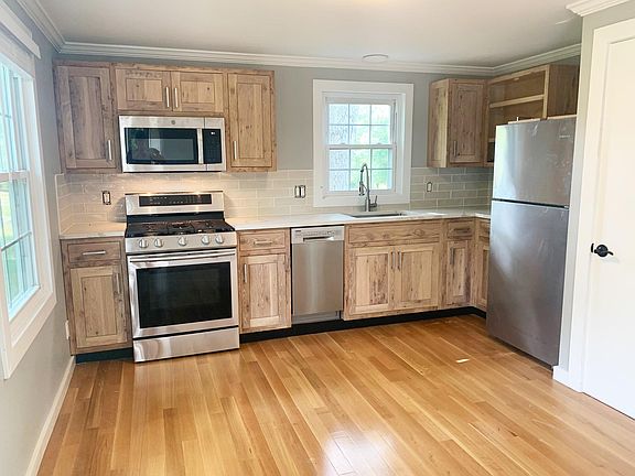 Kitchen- new custom cabinets, all new stainless appliances, hardwood floors