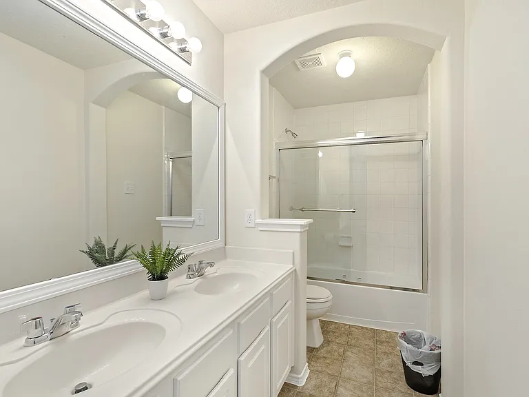 Double vanity is the standard for our royal tenants. This second bathroom has standup shower with tub