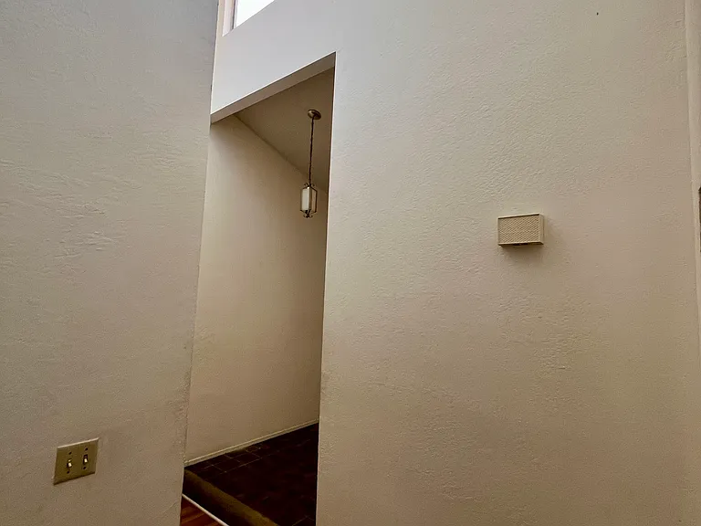 Hallway, entrance, and skylight windows