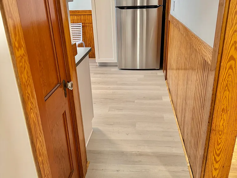 Looking through hall at new Energy Saver Refrig/freezer