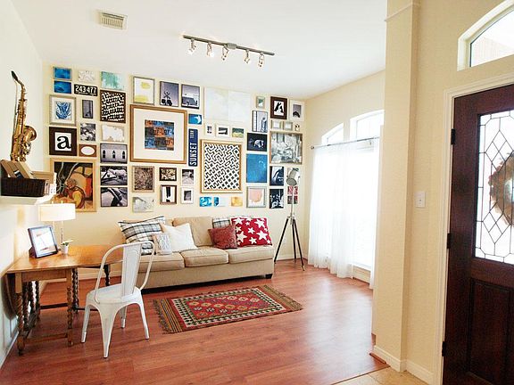 Living area with plenty of light from huge front window.