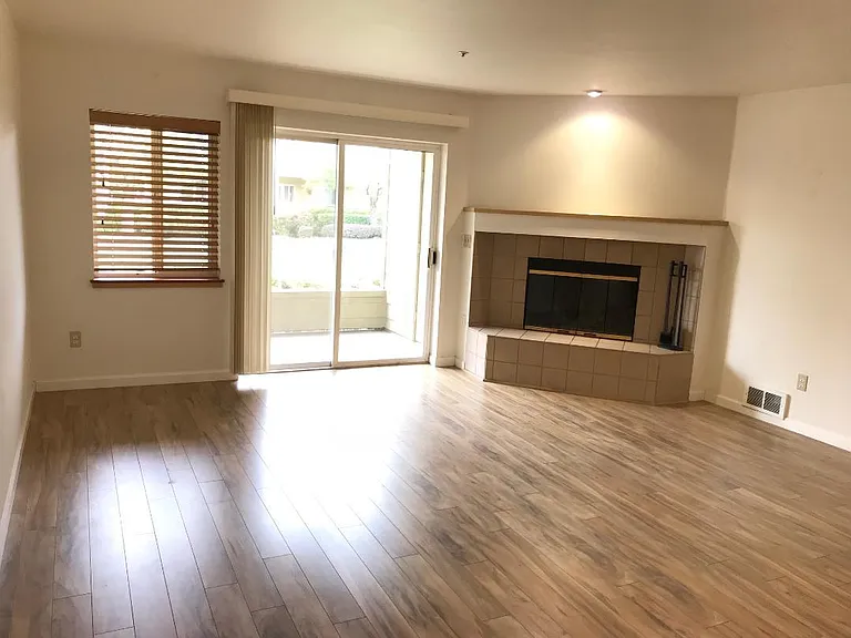 Wood laminate floors throughout.