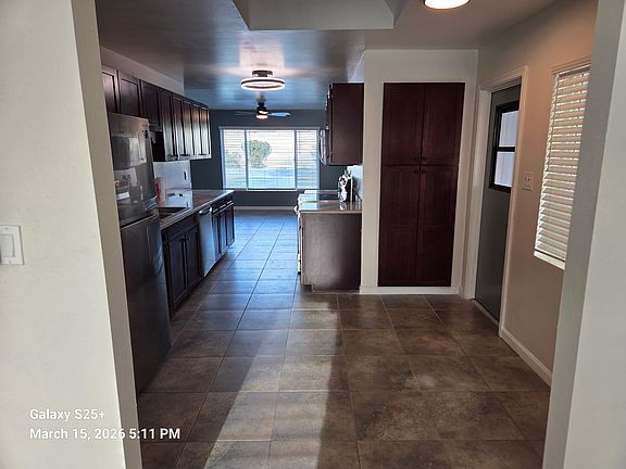 FRONT ROOM INTO KITCHEN ... CARPORT DOOR ACCESS