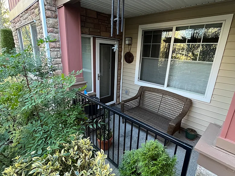 Back patio to the left of the rear entrance of the condo building
