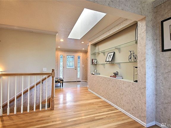 Lots of natural light greets you as you enter this home. Extensive hardwood floors add warmth & are low maintenance.