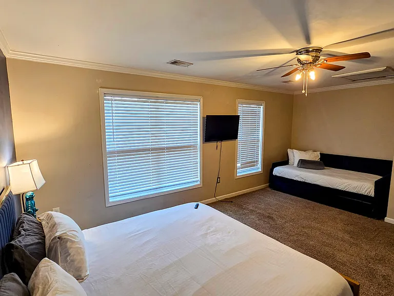 master bedroom with sofa setup