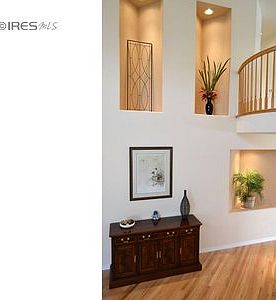 Welcoming entry with art niches.
