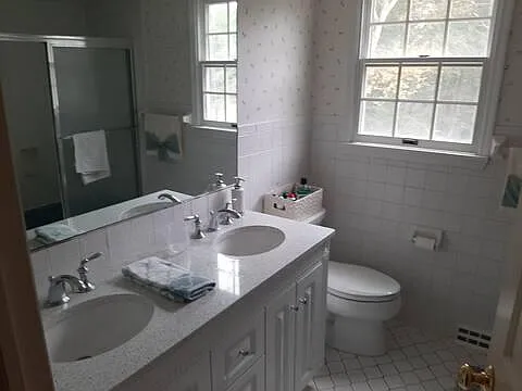 one bathroom with a tub (the tub is not in the photo), also a linen floor-to-ceiling cabinet behind the door (not shown in the photo)