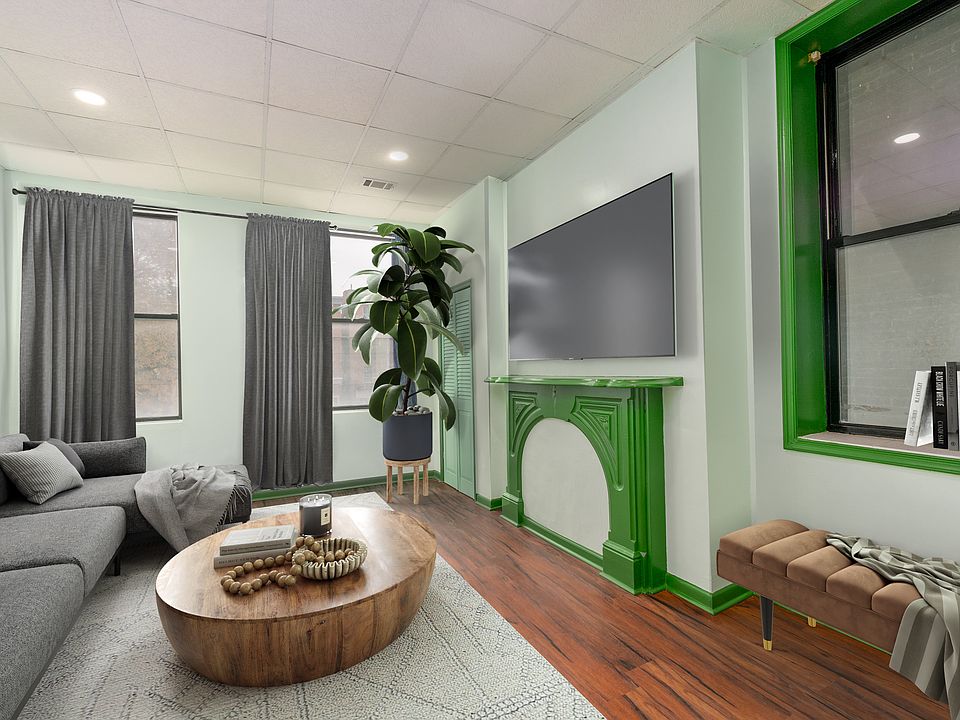 Living room/bed room is virtually staged.