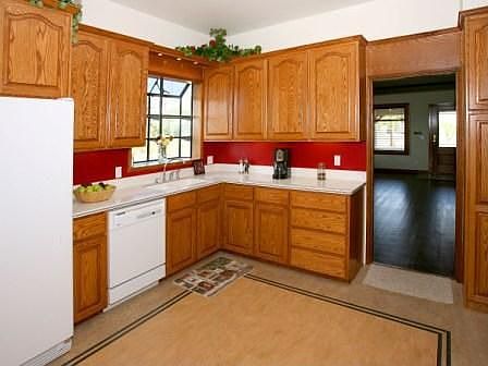 Custom Oak Cabinetry, Corian Counters, Marmoleum Floor. Appliances Included.