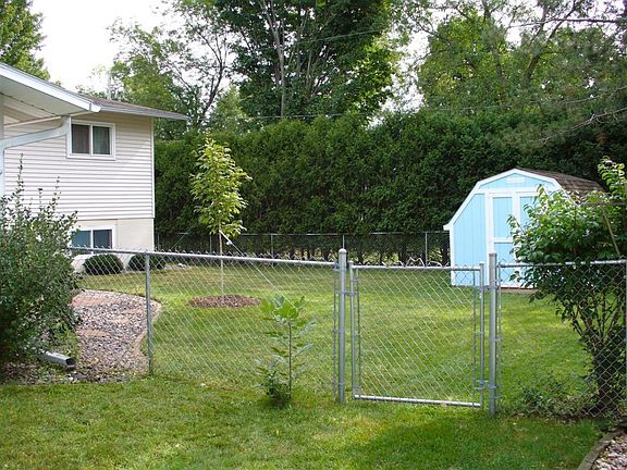 Another view of the backyard from the side of the house, sho