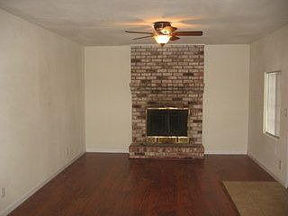 Living room with wood burning fireplace
