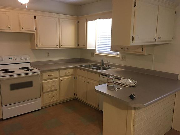 Kitchen with bar top seating