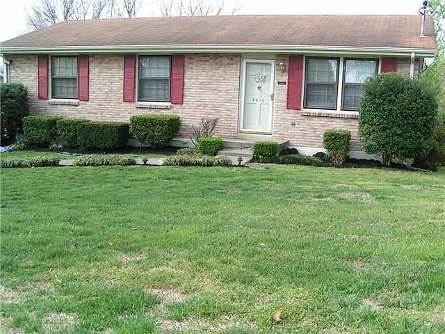 Beautifully landscaped home with double paved drive