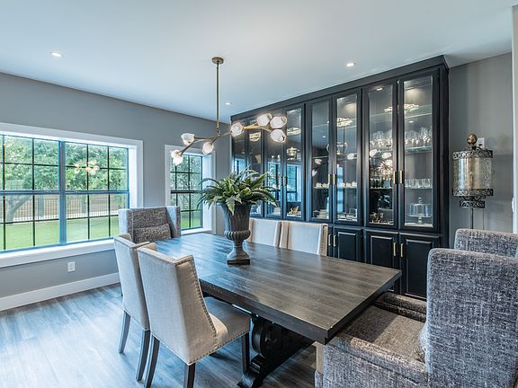 Sophisticated dining with high-end finishes and custom cabinetry.