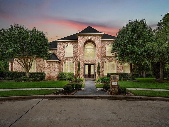 Welcome to 14 Lochbury Court, an exquisite Bob Hale custom home in the gated section of Manor Lake Estate of the premier master planned community of Gleannloch Farms.