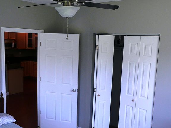 Carpeted bedroom with spacious closet