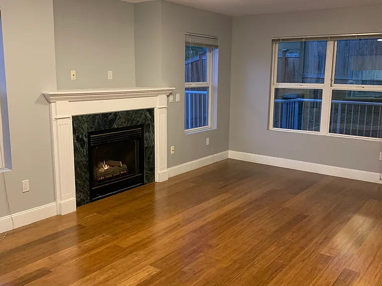 104 Living room.
Hardwood flooring and gas fireplace.