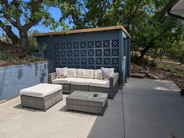 Large patio with several seating areas is accessible from the Dining Room, the Kitchen and the Master Bedroom