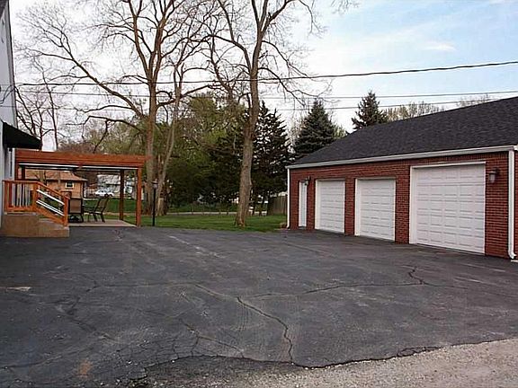 Garage. HUGE FINISHED GARAGE WITH SURROUND SOUND AND LARGE OVERHEAD DOOR FOR THE BIG TRUCK!!