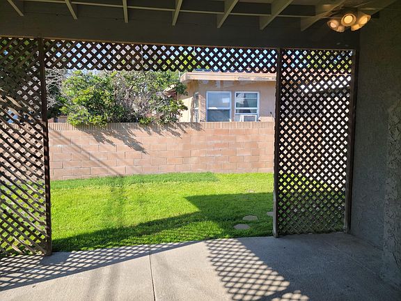 Semi-Covered Patio & Backyard.