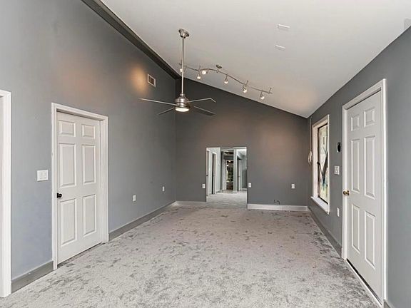 Living room with tall ceilings and plenty of natural light