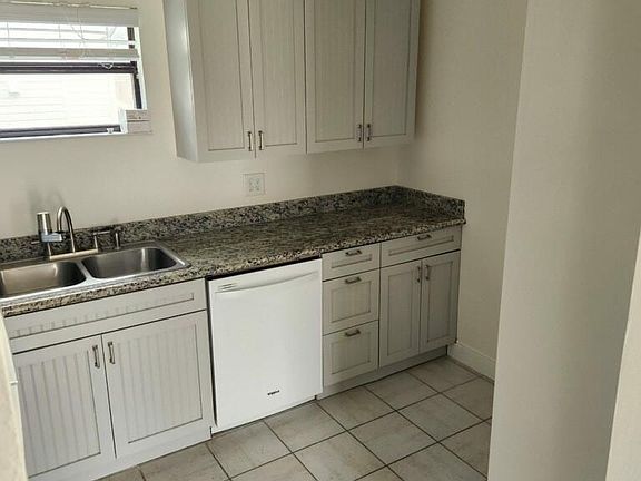 Another view of the kitchen, including dishwasher. Additional photos are available upon request.