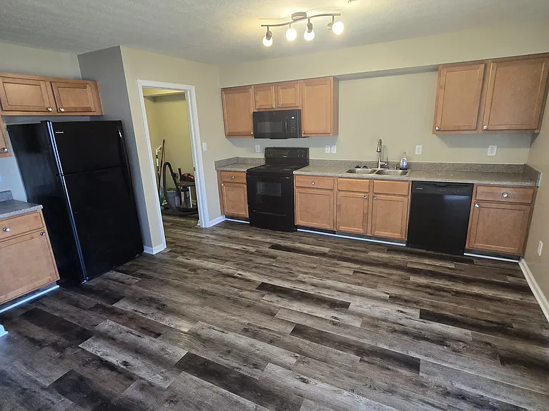 Kitchen View with Laundry/Pantry access, and sliding door on the right