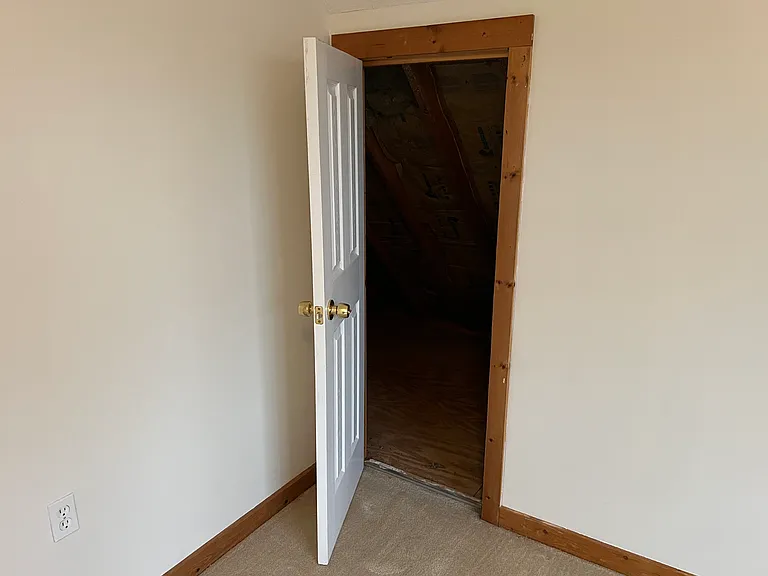 Second door for attic storage space.