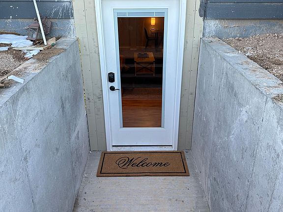 Private entrance with lighting and a electronic keypad for your safety.