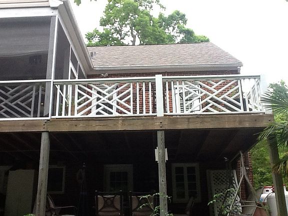 Large open deck connected to screened in porch.