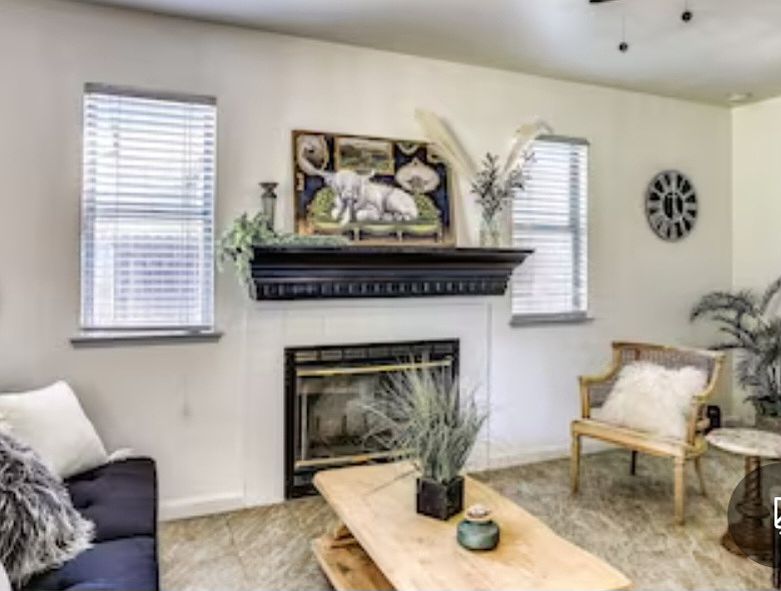Cozy Family room with fireplace and plenty of sitting room.