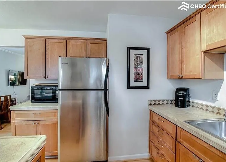 Large stainless fridge in Kitchen
