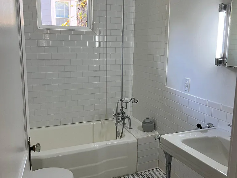 Restored bathroom - fixtures, tub and tile are original to this home and lovingly cared for.