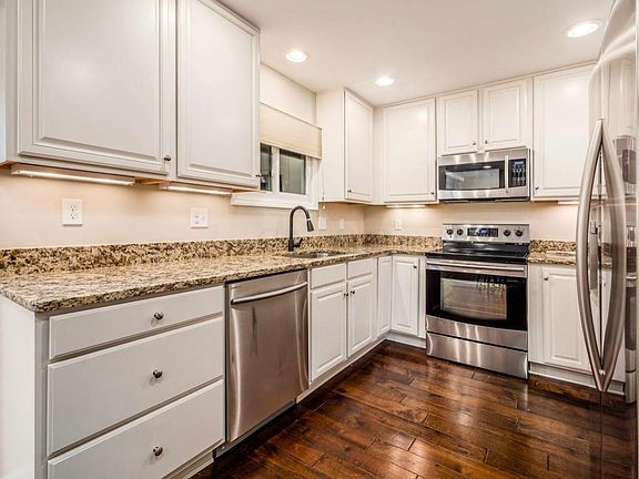 Modern kitchen with granite counters and upgraded cabinetry